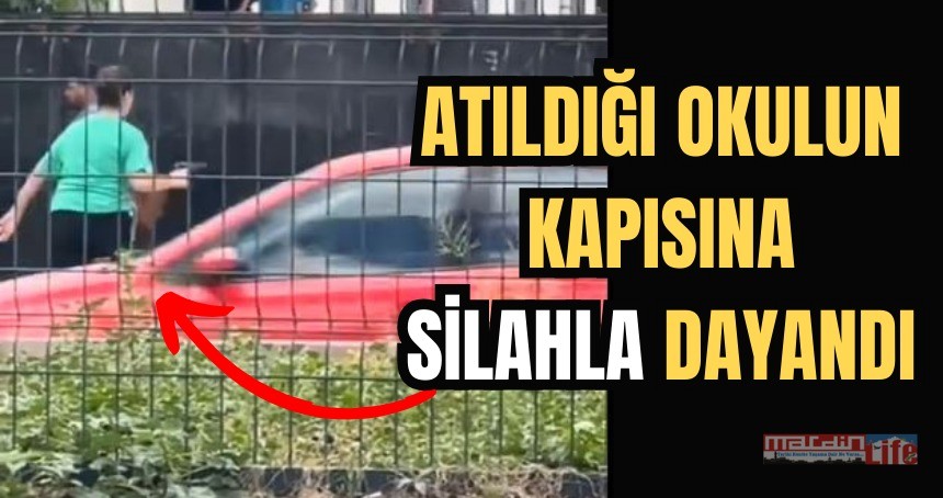 Okulun kapısına silahla dayandı