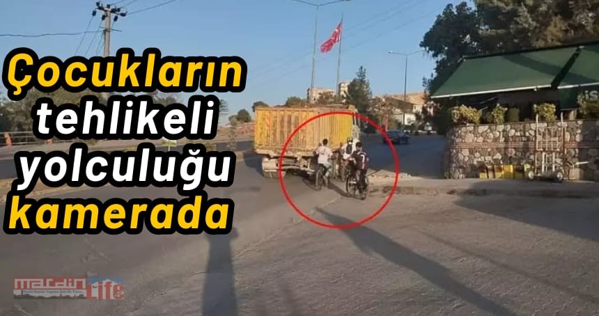 Kamyona tutunan bisikletli çocukların tehlikeli yolculuğu kamerada
